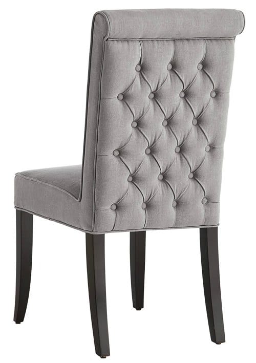 This stunning tufted accent chair is perfect for the dining table or home office. 