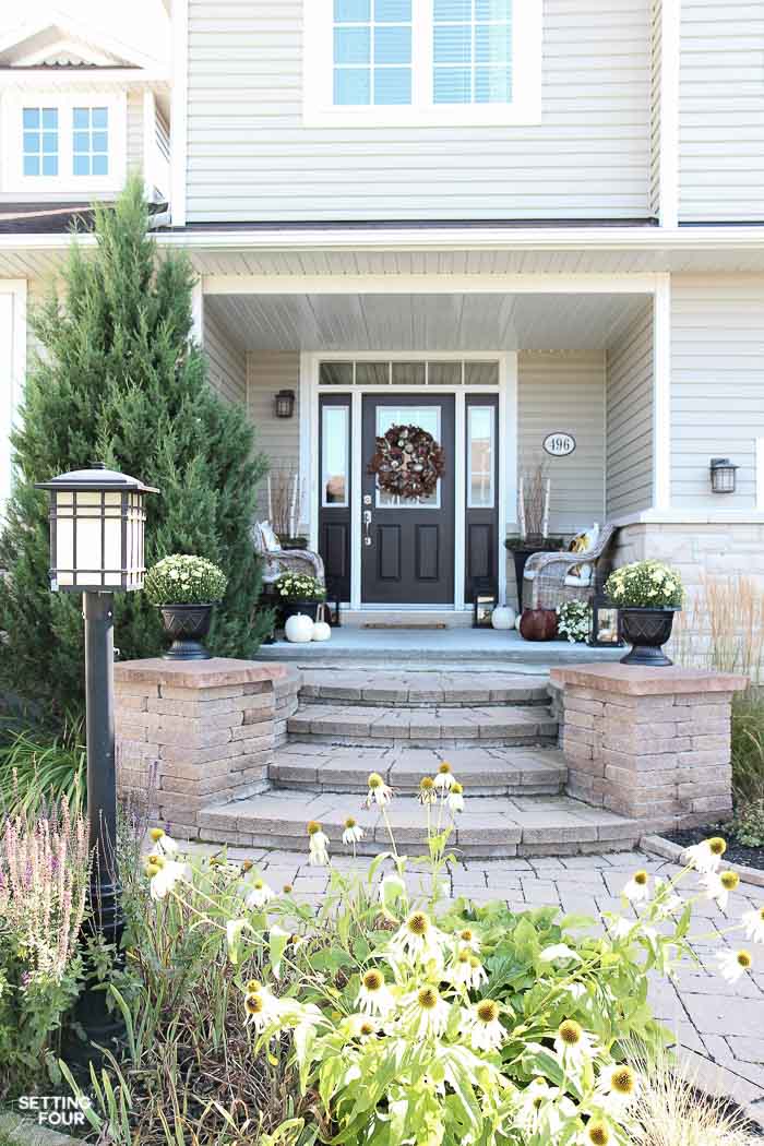 Looking for new ideas to decorate your Front Porch? Come see my COZY RUSTIC FALL PORCH Decor with lots of DIY home decor ideas to add curb appeal to your home! Easy fall decorating ideas for using pumpkin decorations, fall planters, mums, fall wreath, lanterns and more! See all the porch decorating tips!