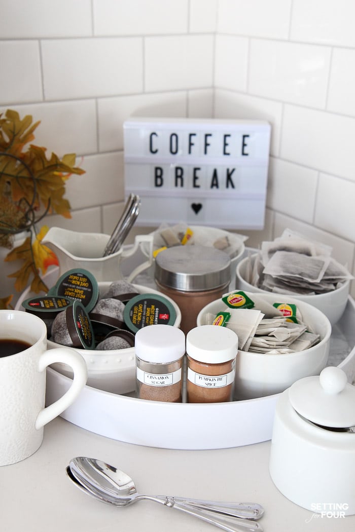 Make this quick and easy coffee bar on a kitchen countertop with round tray to organize your coffee, tea, hot chocolate, coffee toppings!