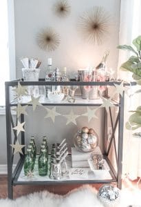 Bar Carts and New Year's Eve Parties go hand in hand! Learn how to create a fun New Years Eve Bar Cart with festive party supplies, delicious food and bubbly drinks! Celebrate the New Year in style!