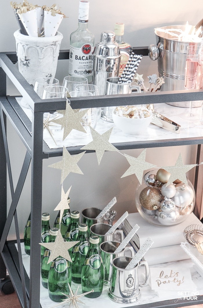 Bar Carts and New Year's Eve Parties go hand in hand! Learn how to create a fun New Years Eve Bar Cart with festive party supplies, delicious food and bubbly drinks! Celebrate the New Year in style! Bar Carts and New Year's Eve Parties go hand in hand! Learn how to create a fun New Years Eve Bar Cart with festive party supplies, delicious food and bubbly drinks! Celebrate the New Year in style!