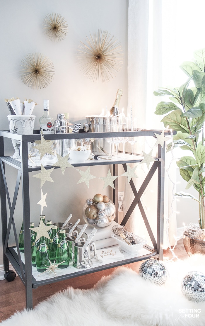 Bar Carts and New Year's Eve Parties go hand in hand! Learn how to create a fun New Years Eve Bar Cart with festive party supplies, delicious food and bubbly drinks! Celebrate the New Year in style!