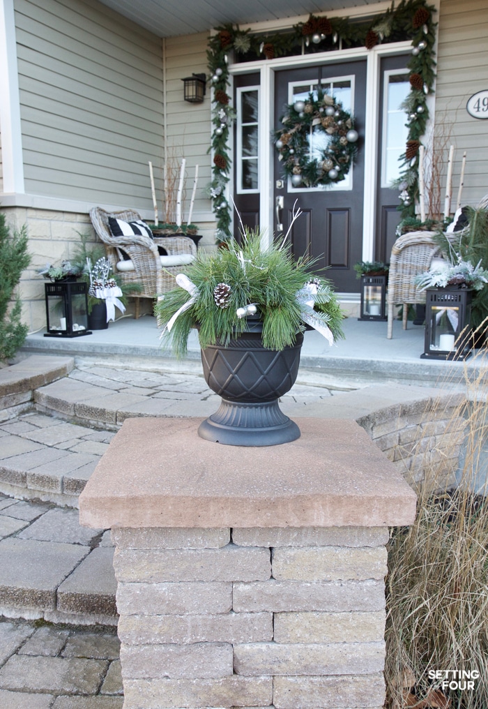 Gorgeous Christmas DIY Decor Idea! In just a few minutes you can put together this Quick and Easy Outdoor Christmas Planter for your front door area or porch! This holiday decorating idea is so easy - even if you aren't a decorator!