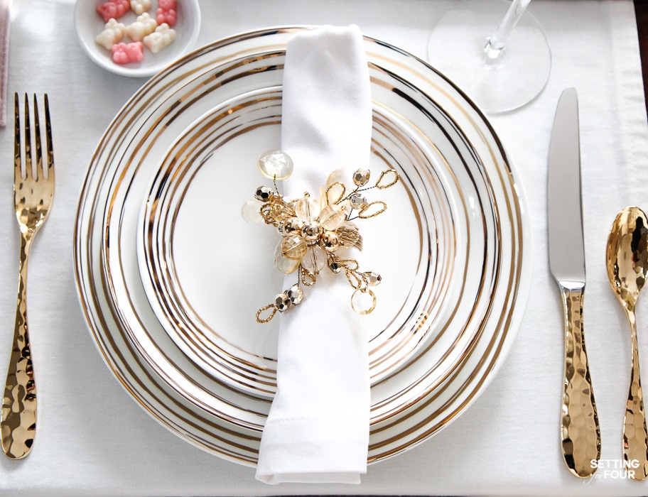 Valentines Day Dinner Party Ideas : To celebrate those you cherish! Gold flatware, white and gold dinnerware and pink and white gummy bear treats.