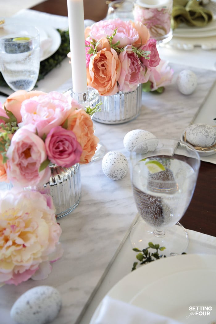 Beautiful Easter dinner party planning decor ideas. Floral centerpieces and DIY Easter egg decorations.