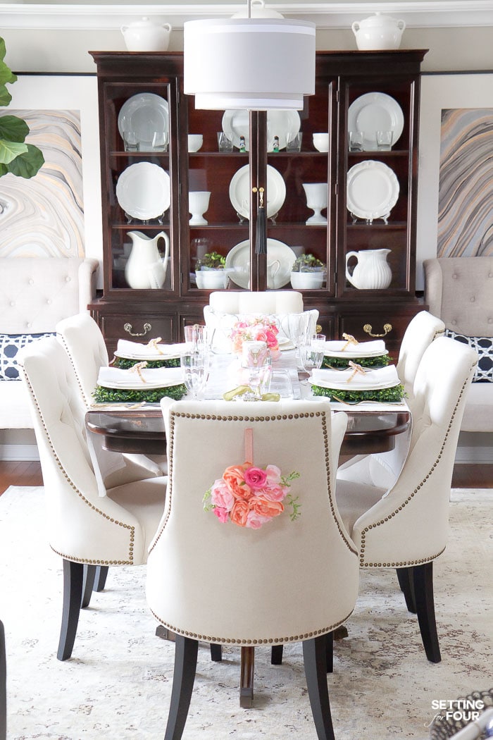 Easter decor ideas for the dining room. DIY floral wreaths for chair backs.