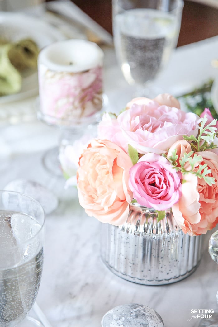 DIY tablescape with faux flower centerpieces and DIY Easter eggs.