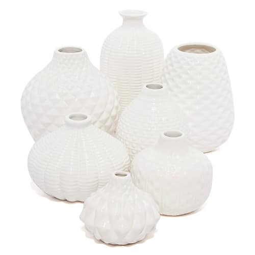 fresh and faux flowers which will both look stunning in this set of 7 artisan bud vases!