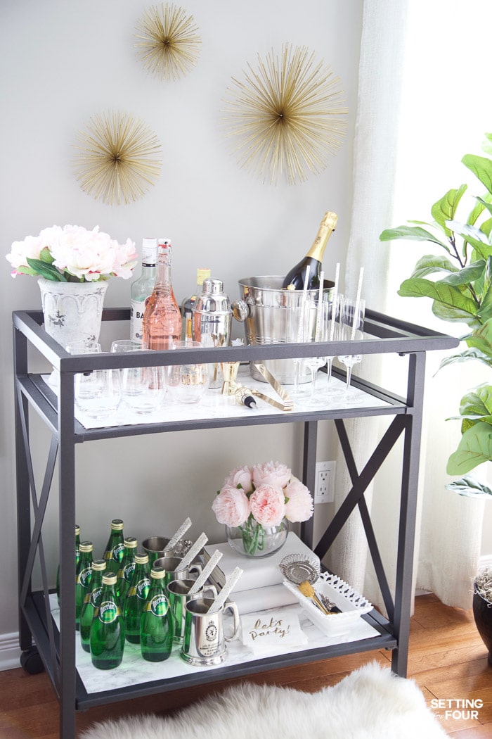 See this quick and easy DIY marble bar cart top and shelf tutorial to give your bar cart the look and elegance of real marble! Marble bar carts are so gorgeous but are SO expensive! Get the look of Carrara marble for less with this easy marble DIY project!