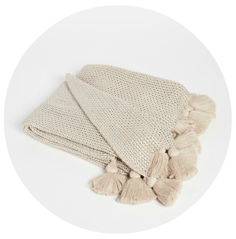 Love tassels and metallics? This stunning throw blanket has both!