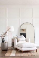 Small room decorating ideas with light colored walls, mirror and layered lighting