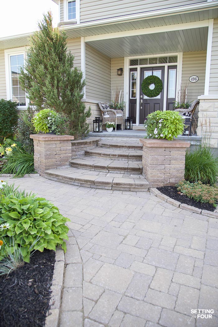 Exterior Design and Landscaping Ideas. Interlock pathway and front steps with pillars for planters. Front porch idea.