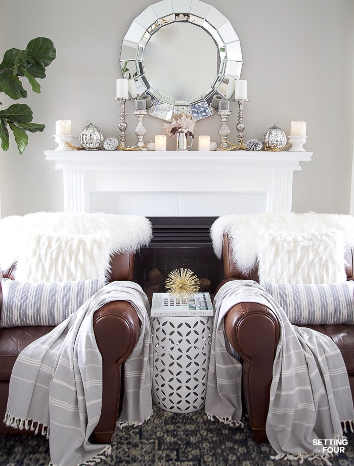 Neutral, white fall mantel decor ideas. #fall #autumn #fireplace #mantel #decor #decorations #pumpkin #pinecones #leaves #candles #livingroom