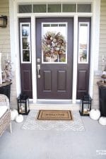 See these Simple Fall Porch Decorating Ideas With Big Impact! Increase your home's curb appeal with easy decor ideas including pumpkins, fall leafy branches and potted mums. #wreath #simple #fall #porch #decor #pumpkins #leaves #mums