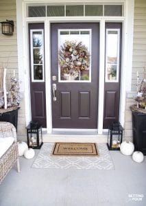 See these Simple Fall Porch Decorating Ideas With Big Impact! Increase your home's curb appeal with easy decor ideas including pumpkins, fall leafy branches and potted mums. #wreath #simple #fall #porch #decor #pumpkins #leaves #mums