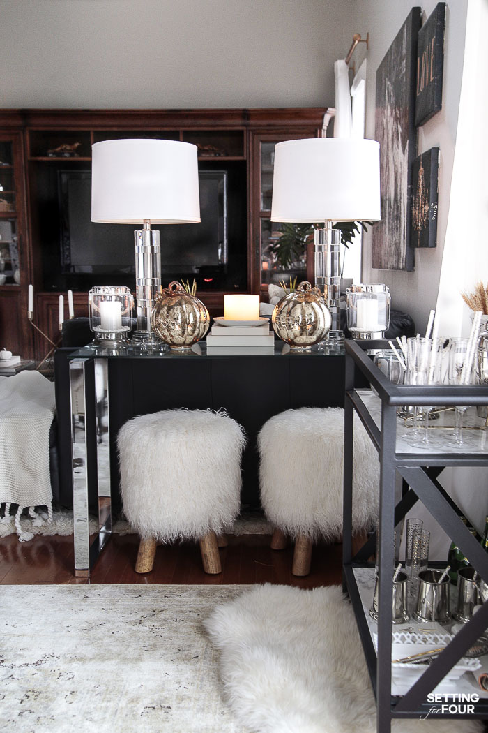 Extra storage and serving space in the dining room with a console table and bar cart. #diningroom #storage #organization #bigger #entertaining #console #barcart