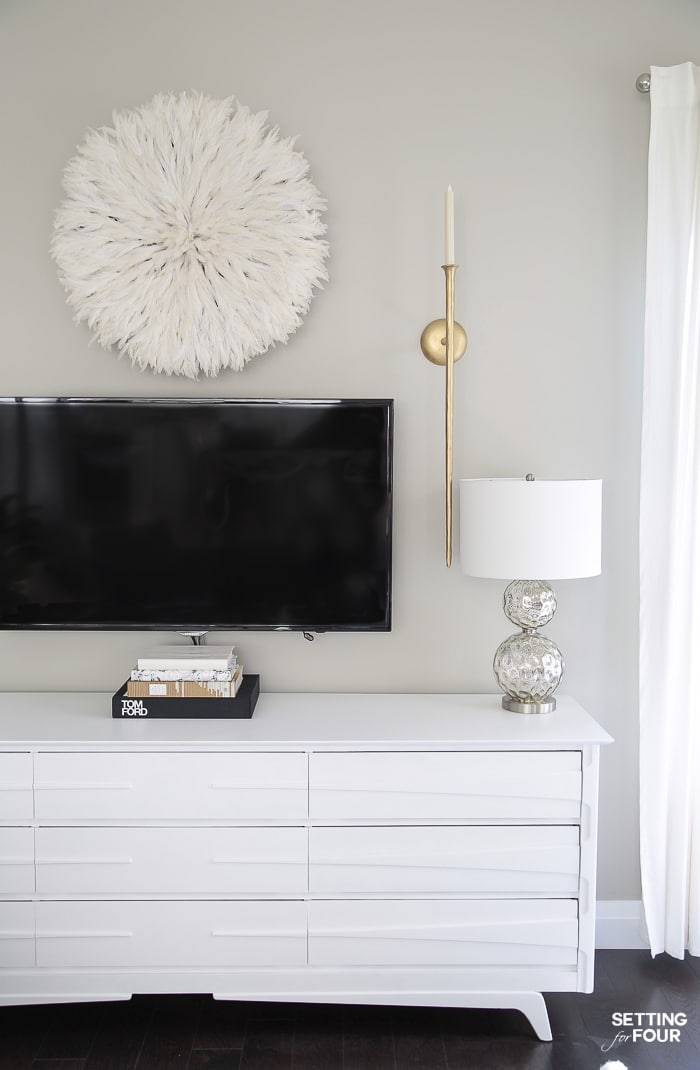 TV Wall Decor Idea - Decorate With A Juju Hat! #lamps #gray #juju #whitedecor #walldecor #tv #tvwall #gallerywall #diy #repurpose #dresser #gold #whitedecor #arearug