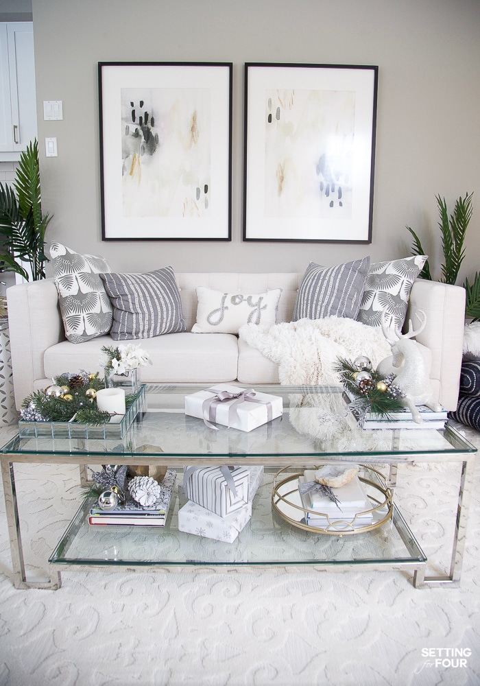 Living room makeover with new wall art, area rug, pillows and TV unit! #livingroom #decor #makeover #room #design #art #rug #TVunit