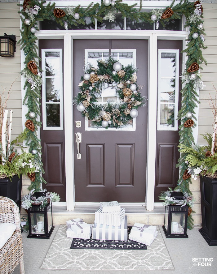 Christmas wreath and door decor with lighting and garland #christmaswreath #christmasdecorideas #christmasgarland #christmaslights #lanterndecor