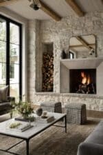 Cozy living room decor ideas with a stone fireplace, wood beams and neutral design