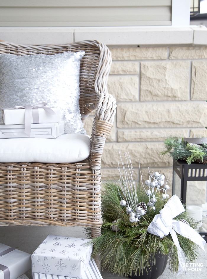 Decorate outdoor wicker chairs with beautiful sequin pillows. They look so pretty with the holiday decor!