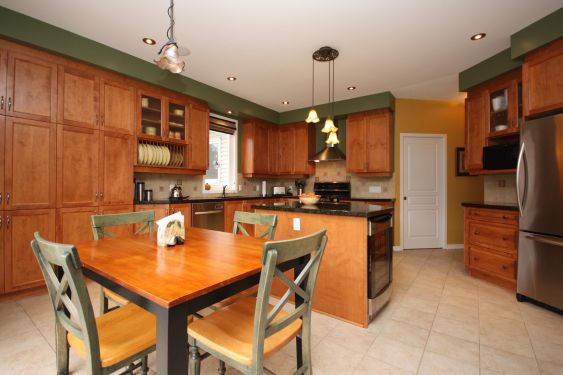 Our dated kitchen with dark cabinets before our kitchen remodel. Rustic kitchen is given a modern makeover on a budget with cabinet refacing. #rustic #kitchen #dark #white #cabinet #refacing #beforeandafter