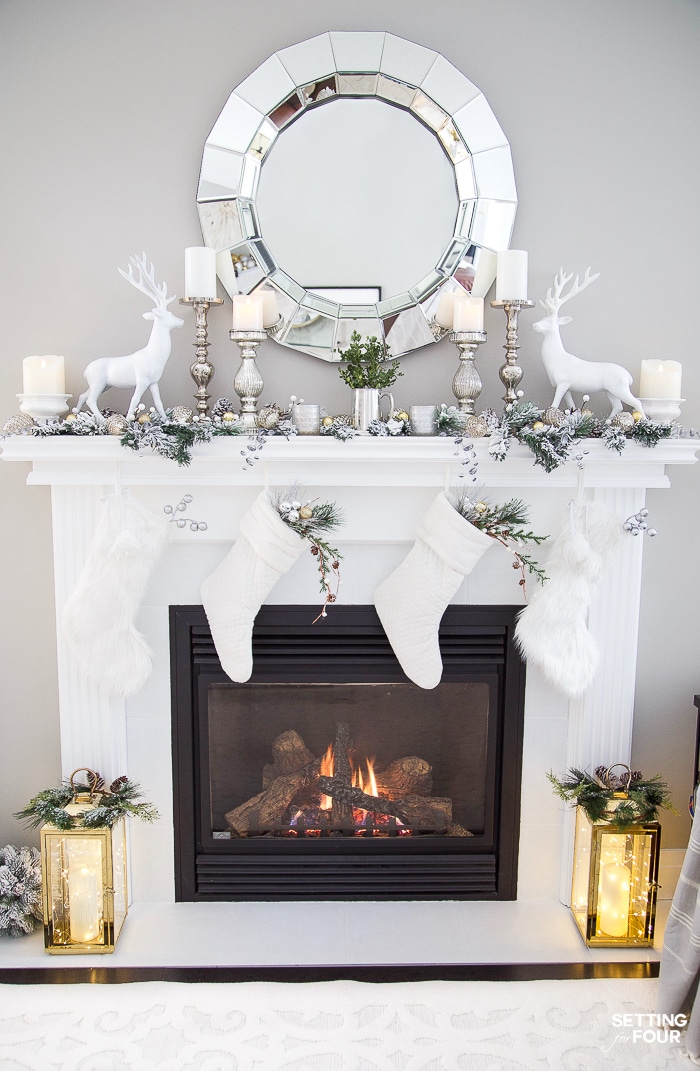 Silver and gold, mixed metallic Christmas mantle decor with reindeer and stockings.