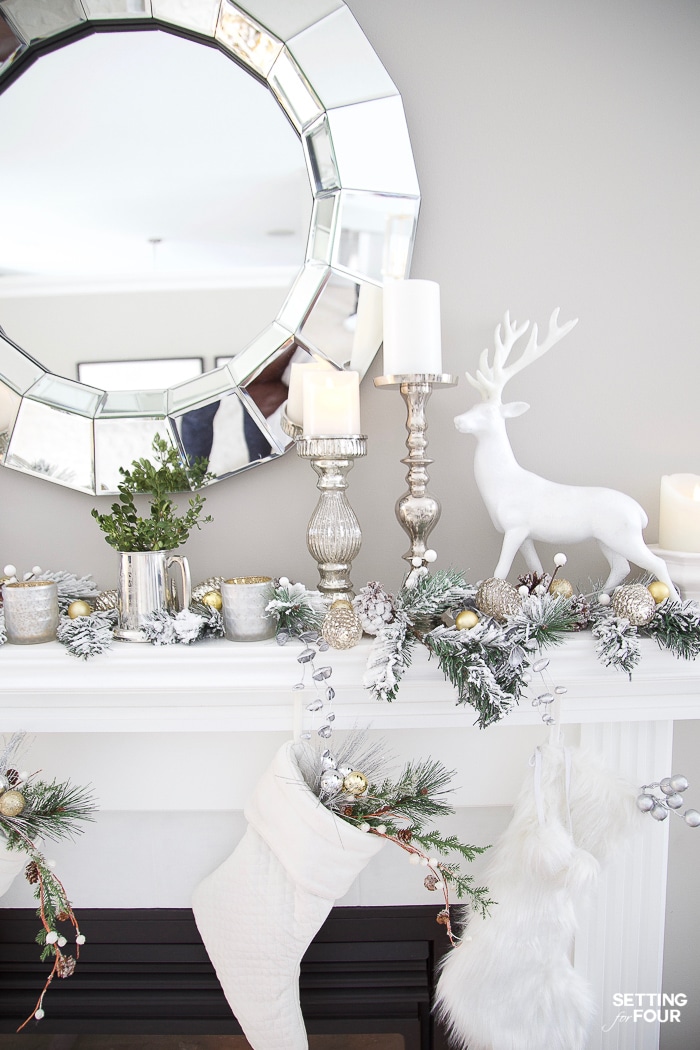 Christmas mantel ideas with garland, deer, candles and stockings. #christmasdecor #xmasdecor #christmasmantel #manteldecor #deer #christmasstockings