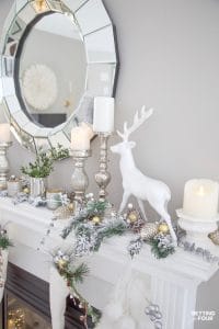 Christmas mantel ideas with garland, deer, candles and stockings. #christmasdecor #xmasdecor #christmasmantel #manteldecor #deer #christmasstockings