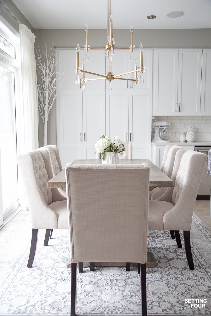 Beautiful beige button tufted dining chairs. Upholstered. Wing back style. Stain resistant and water resistant with scotch guard protector. #upholstery #fabric #dining #chair #tufted