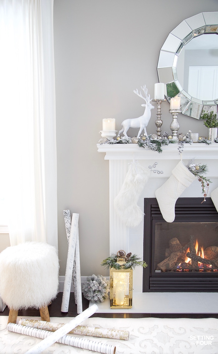 DIY Christmas mantel decor with deer and Pottery Barn stools in living room. #christmasmantel #decoratingideas #livingroom #potterybarn #modern #whimsical