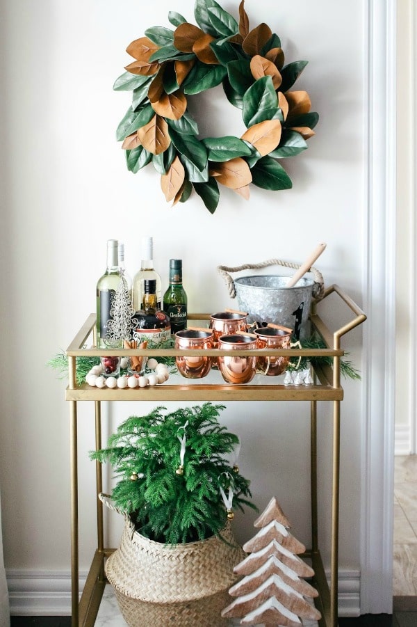 Happy New Year bar cart ideas #barcart #gold #wreath #coppermugs #newyear