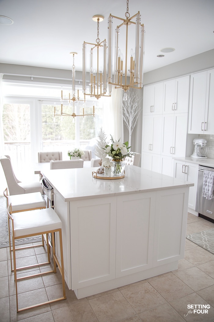 5 Interior Design Tricks To Brighten a Dark Room! These designer tricks will make your room feel bigger too! #whitekitchen #kitchendesign #kitchenremodel #remodel #kitchen #lighting #gold #pendants