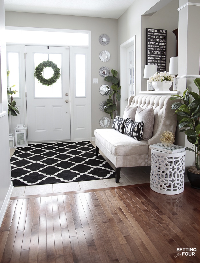 Gorgeous accent mirror gallery wall in an entryway.