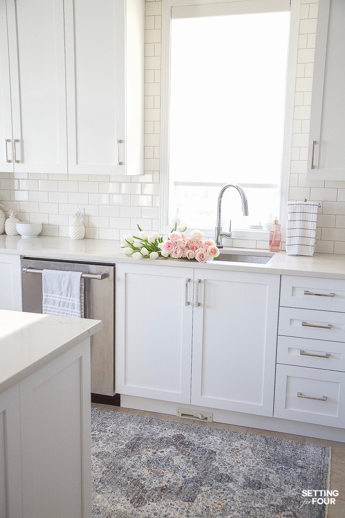 White kitchen decorated for Spring #white #kitchen #cabinets #spring #decor