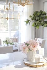 Artificial flowers in a vase to decorate a kitchen island. #decor #decorate #ideas #kitchen #island #spring #faux #peonies