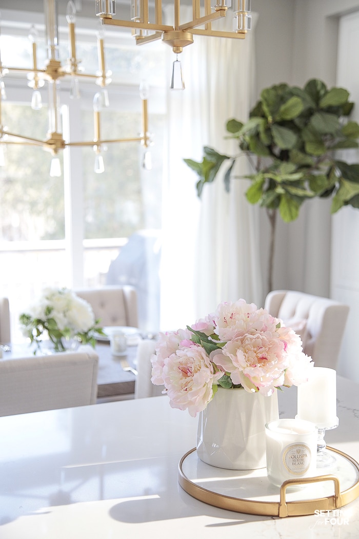 Artificial flowers in a vase to decorate a kitchen island. #decor #decorate #ideas #kitchen #island #spring #peonies