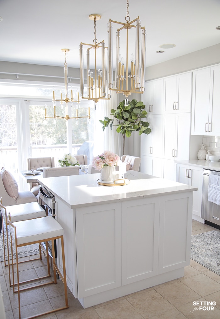White kitchen, brass and crystal lighting, gold and pink accents. #white #kitchen #interiors #room #ideas
