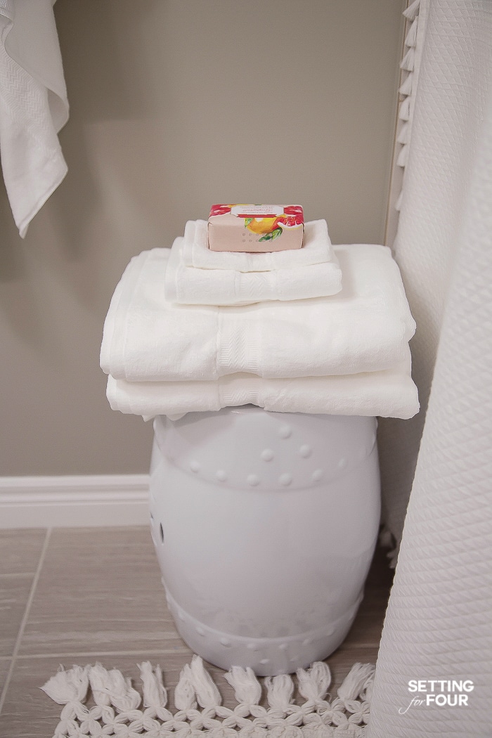 Stack bath towels on a garden stool - so handy when you hop out of the shower! #bathroom #decorations #towels #stool #makeover