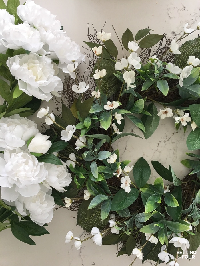 Wreath and peony flower bushes.