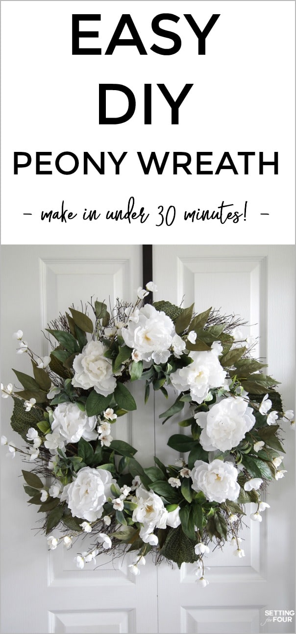 Diy Peony wreath hanging on a white door.