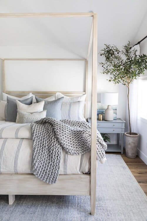 Serene Modern Coastal Decor Ideas. minimalist, canopy bed, wood bed, blue and white, luxury, summer decorating, classic, modern, transitional, farmhouse design