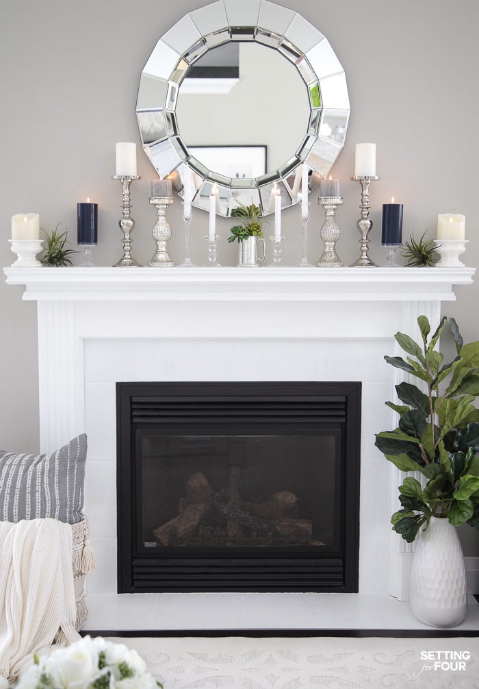 White fireplace mantel and tile.