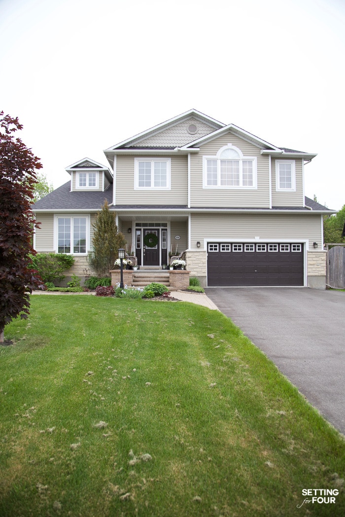 Roof shingle color and exterior colors of a two story home.