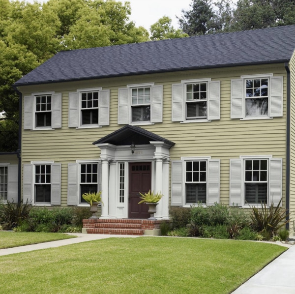 See this beautiful home exterior with siding painted Back To Nature by Behr. Color of the Year 2020.