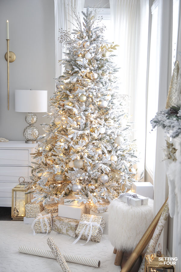 Learn how to create this gorgeous decorated flocked Christmas tree with gold and white ornaments! 