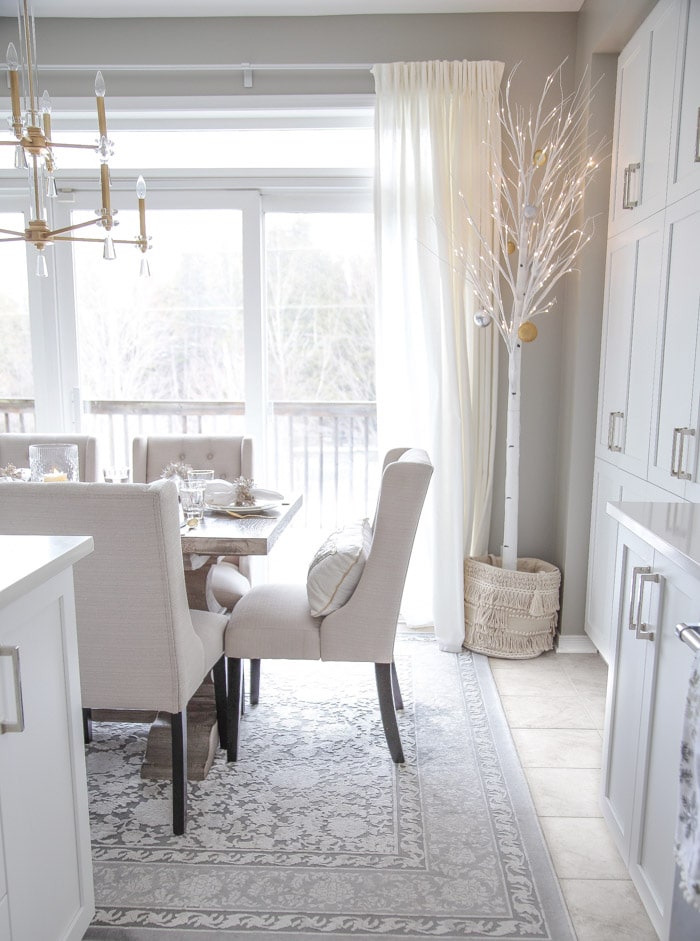 How to Decorate a kitchen for Christmas with artificial pre-lit white birch trees.