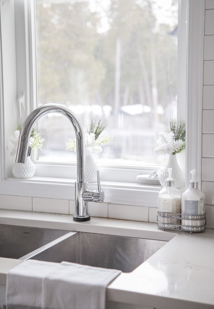 How to decorate the kitchen sink area for Christmas with dollar store decor.