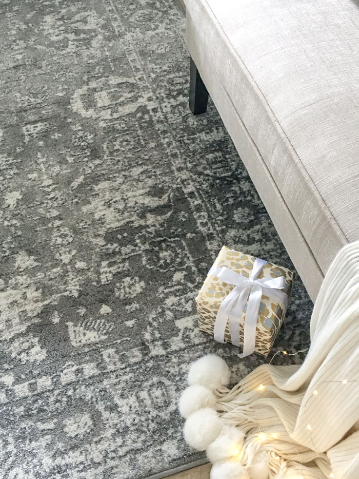 Beautiful gray and ivory area rug in the foyer for Christmas style.