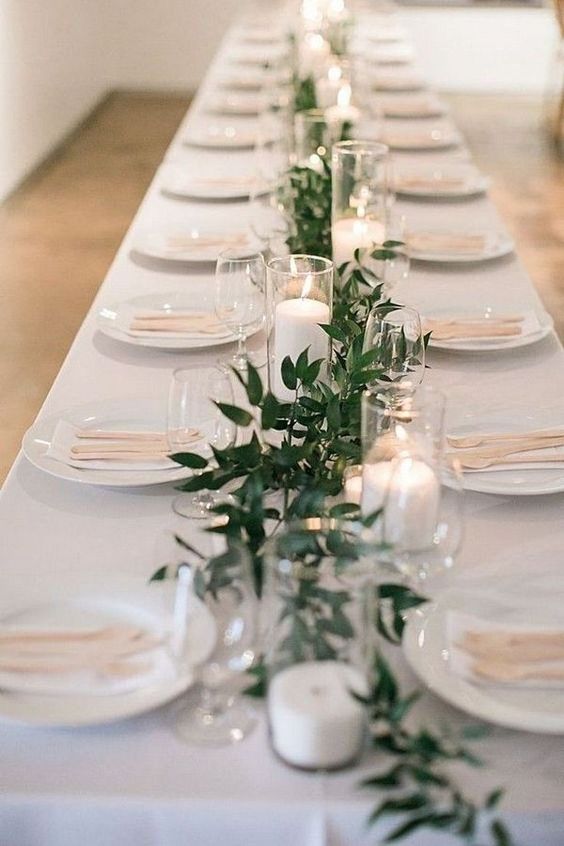 Simple elegant table setting with candles for winter